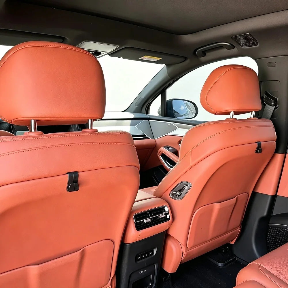 Premium orange leather car seat upholstery with high-quality stitching and ergonomic design.