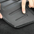 Black waterproof TPE car floor mat with textured anti-slip edges and recessed grooves.