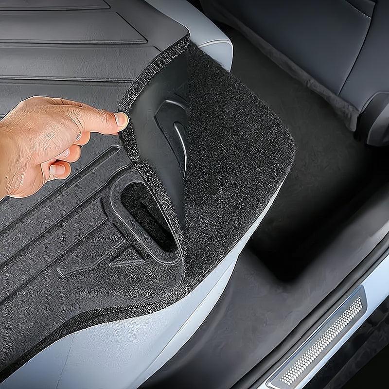 Black dual-layer car trunk mat featuring a durable TPE top layer and protective felt bottom.