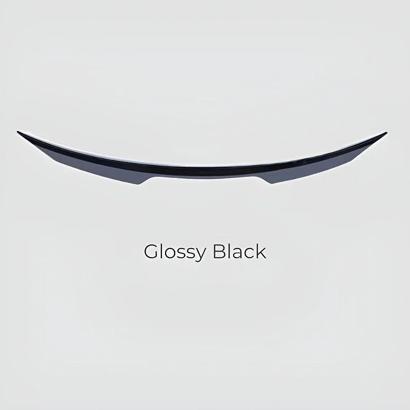 Sleek glossy black car spoiler with a curved aerodynamic design.