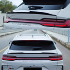 Sleek black carbon fiber rear spoiler for BYD, featuring a high-gloss aerodynamic design.