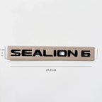 Black glossy SEALION 6 emblem for BYD, measured at 21.3 cm long.