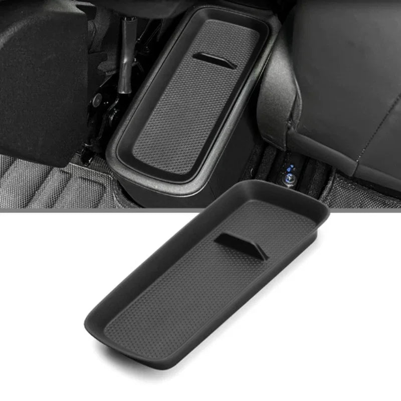 Black textured matte plastic center console organizer tray for BYD car interior.