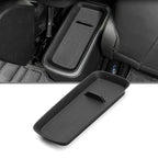 Black textured matte plastic center console organizer tray for BYD car interior.
