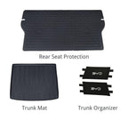 Black heavy-duty rubber car accessory set including rear seat protection, trunk mat, and organizers.