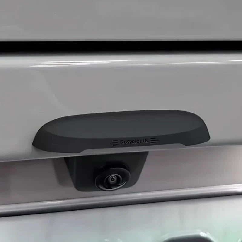Matte black Rosyclouds rear-view backup camera mounted on a silver vehicle bumper.