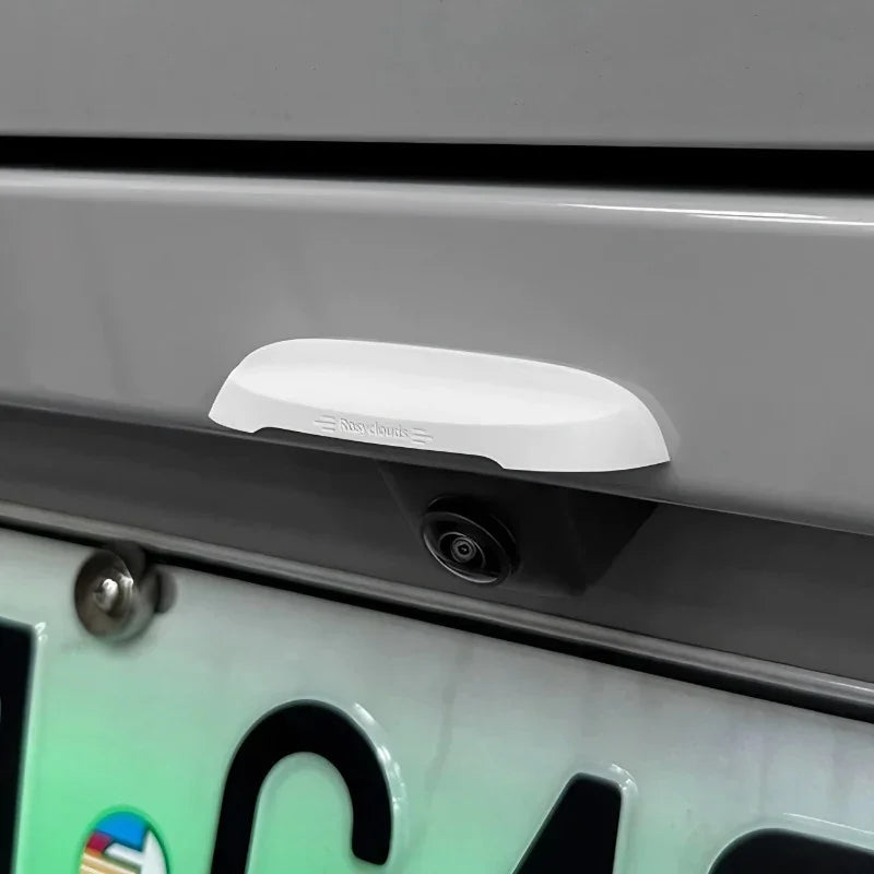 White aerodynamic rear bumper camera cover housing for BYD vehicle protection.