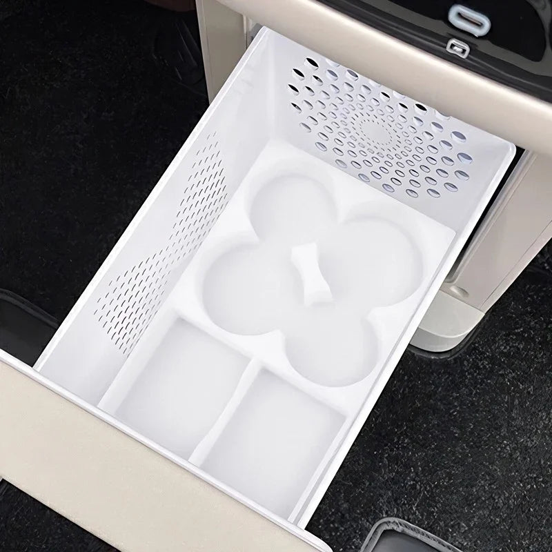 White plastic center console organizer tray with custom compartments for car interior