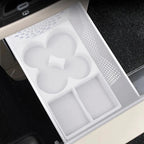 White silicone center console organizer tray with custom compartments for car interior.