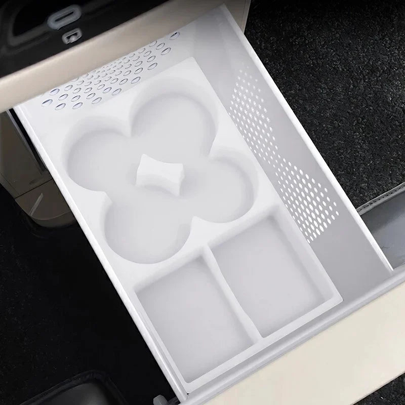 White silicone center console organizer tray with custom compartments for car interior.