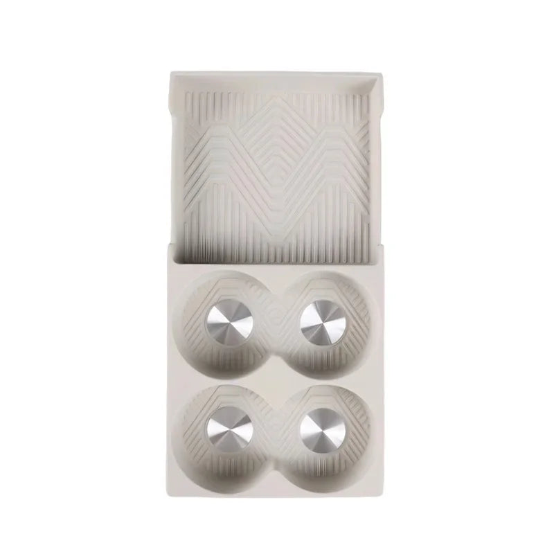 Cream beige TPE center console tray with anti-slip texture and four custom-fit cup holders.
