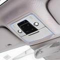 Premium light gray interior overhead console with integrated LED ambient lighting and control buttons.