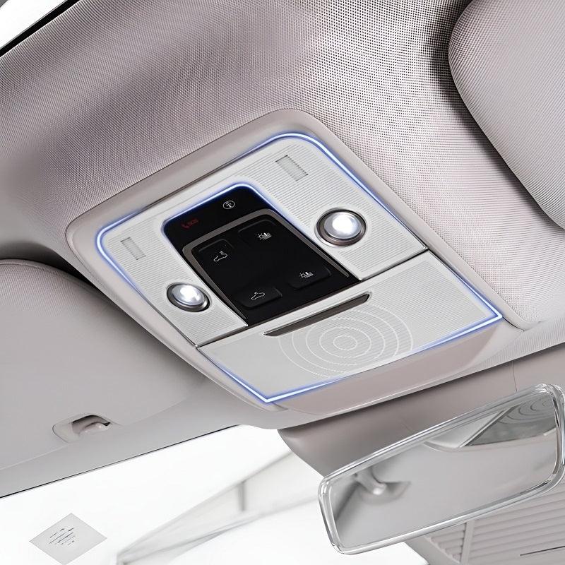 Premium light gray interior overhead console with integrated LED ambient lighting and control buttons.