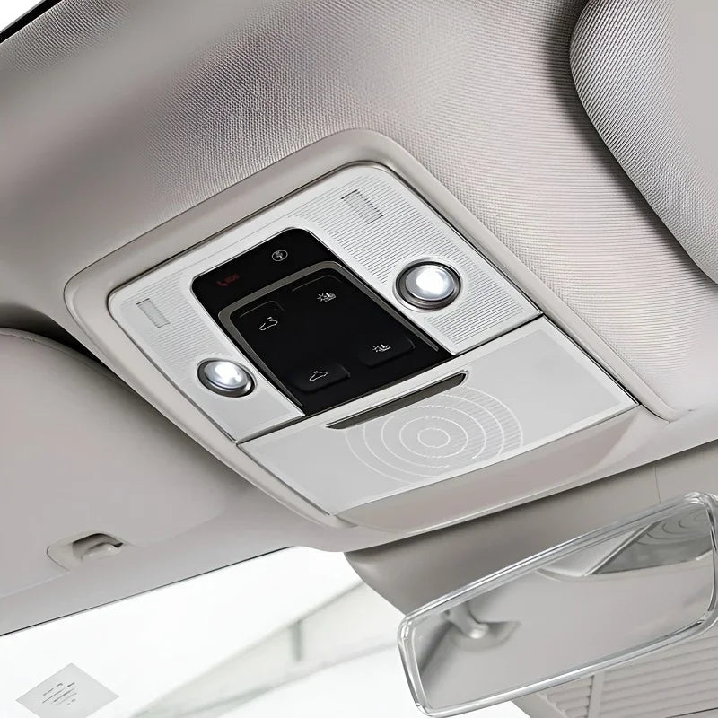 Premium light gray interior overhead console with integrated LED reading lights and control buttons.