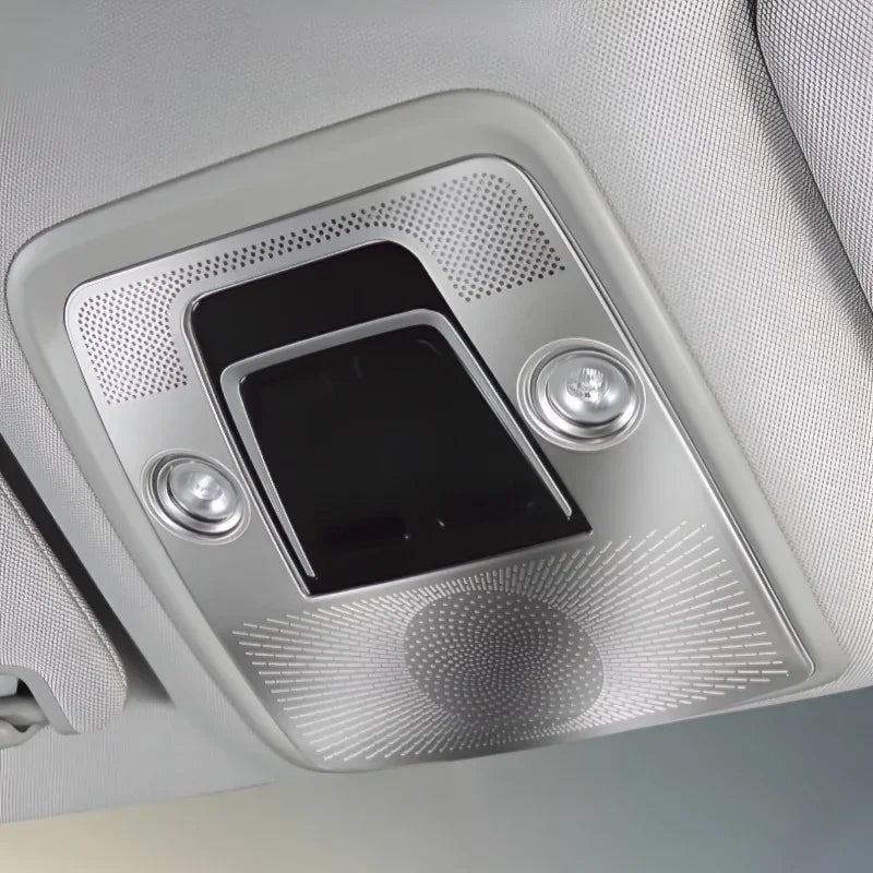 Interior overhead console with silver metallic finish and integrated lighting components.