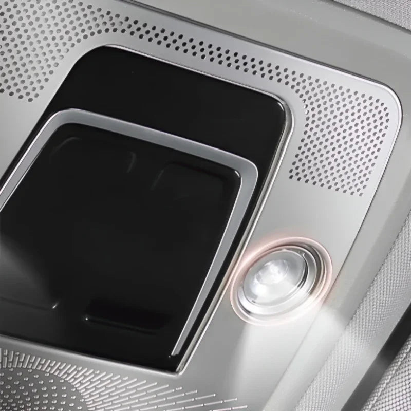 Silver metallic interior panel featuring a black control switch and a bright LED reading light.