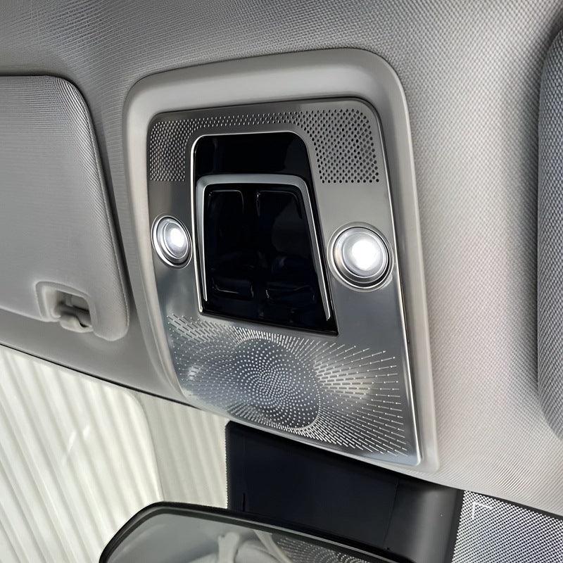 Silver metallic interior overhead console with integrated LED reading lights and black trim.
