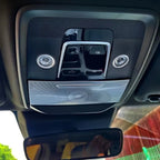 Black interior overhead console with silver metallic accent trim and integrated LED reading lights.