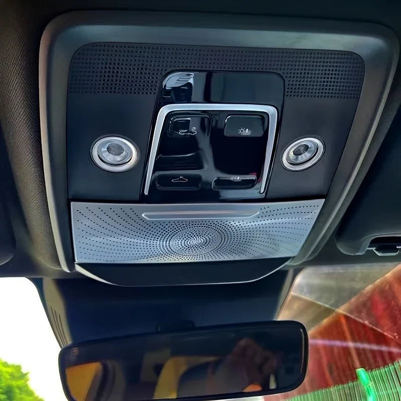 Black interior overhead console with silver metallic accent trim and integrated LED reading lights.