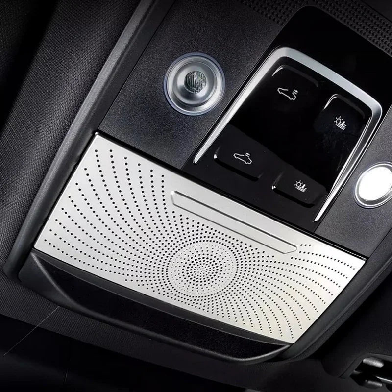 Silver perforated metal overhead console trim with integrated control buttons for BYD interior.