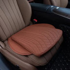 Brown perforated leather car seat cushion with quilted stitching for premium comfort.