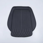 Black perforated leather car seat cover with vertical stitching and diamond quilted pattern.