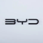 Glossy black 3D BYD emblem made of premium durable material on white background
