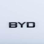 Glossy black BYD emblem made of premium durable material for car exterior decoration