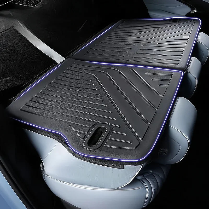 Black premium textured rubber car seat covers with sleek blue LED light edging.