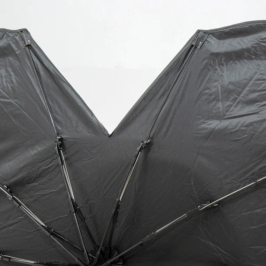 Durable black waterproof fabric umbrella canopy with reinforced metal ribs.