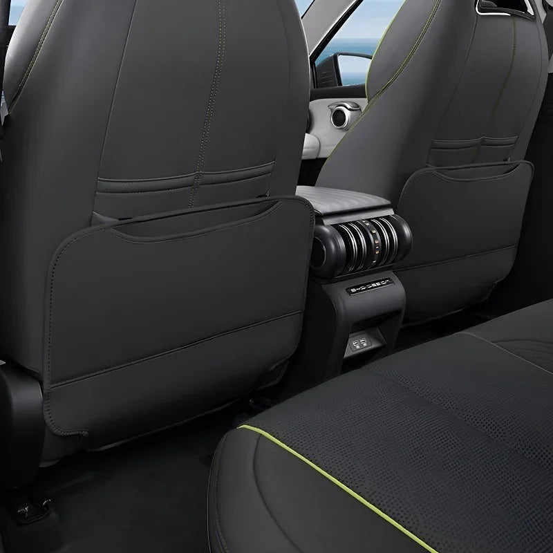 Black leather car seat covers with lime green contrast stitching for BYD interior protection.