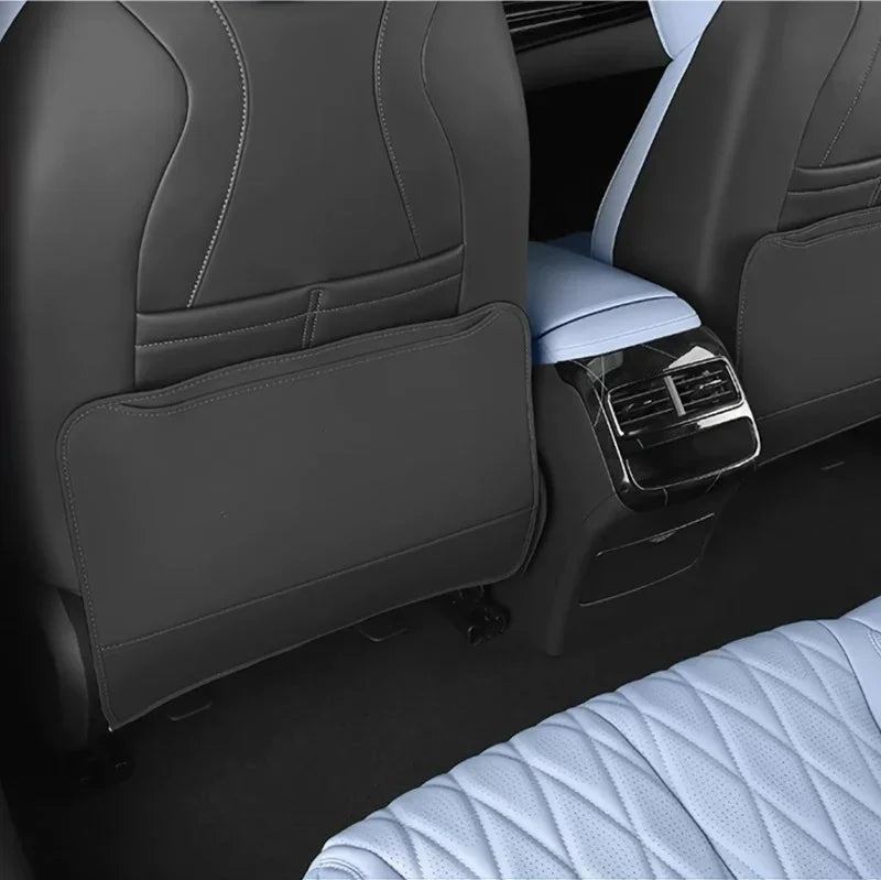 Premium grey and light blue leather car seat covers with quilted stitching and storage pocket.