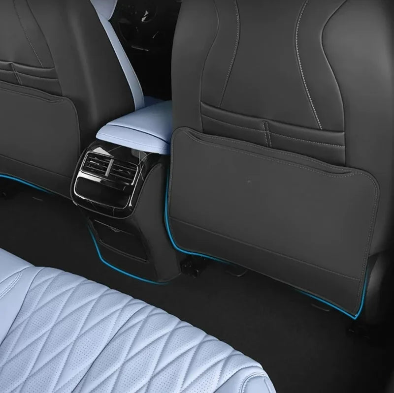 Custom light blue and grey leather car seat covers with diamond stitching and blue piping.