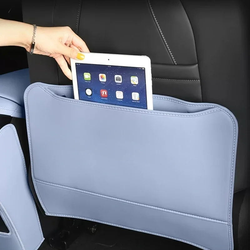 Light blue leather car seat back organizer with a tablet in the storage pocket.