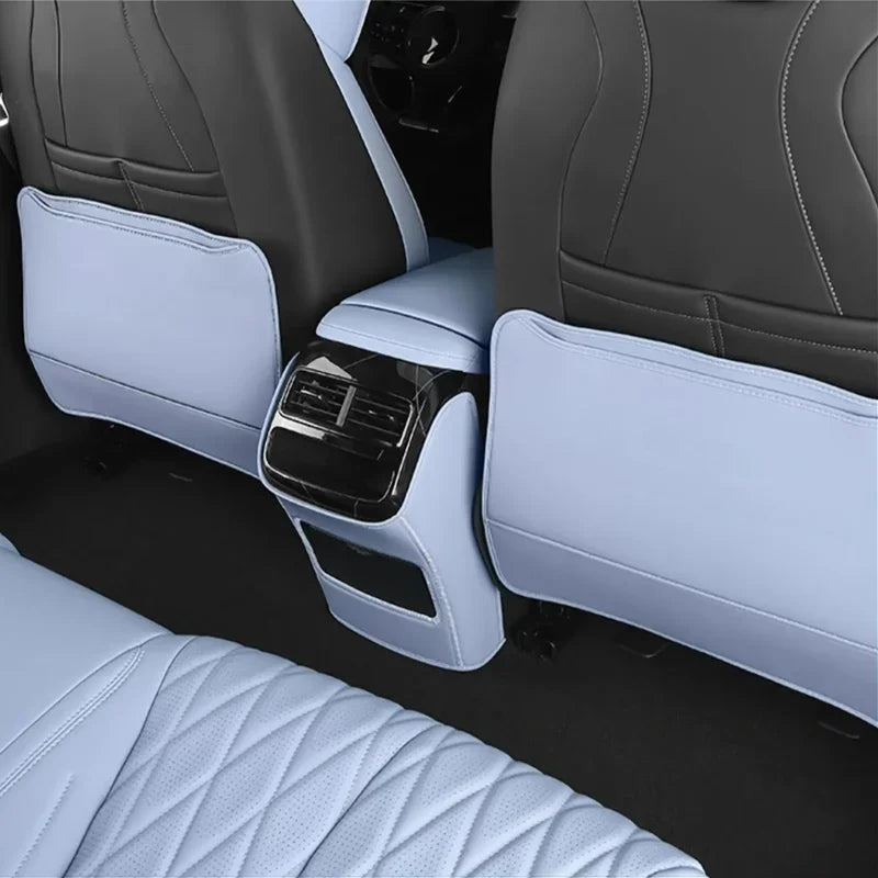 Custom two-tone light blue and dark grey leather car seat covers with diamond stitching.