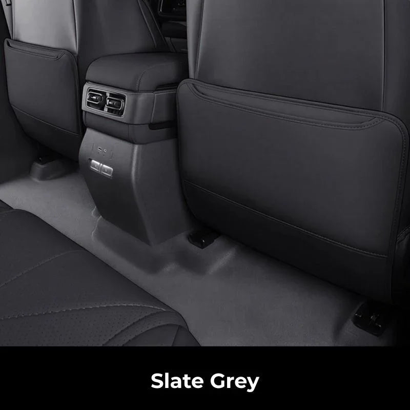 Slate grey premium leather car seat covers and protective floor mats for interior durability.