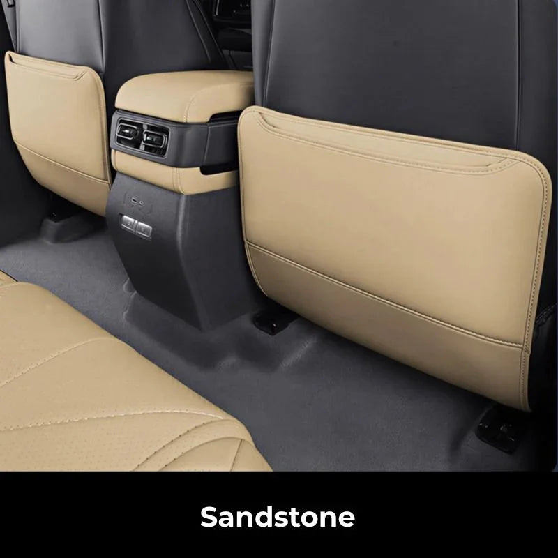 Sandstone beige premium faux leather seat back protectors for BYD vehicle interior.