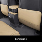 Sandstone beige premium faux leather seat back protectors for BYD vehicle interior.