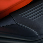 Black textured rubber car floor mat protecting the interior against spills and wear.