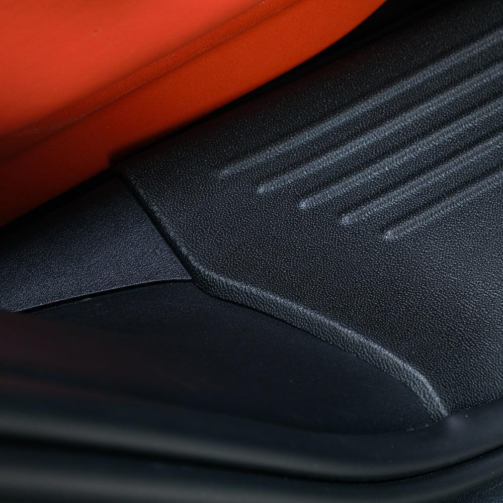 Black textured rubber car floor mat protecting the interior against spills and wear.