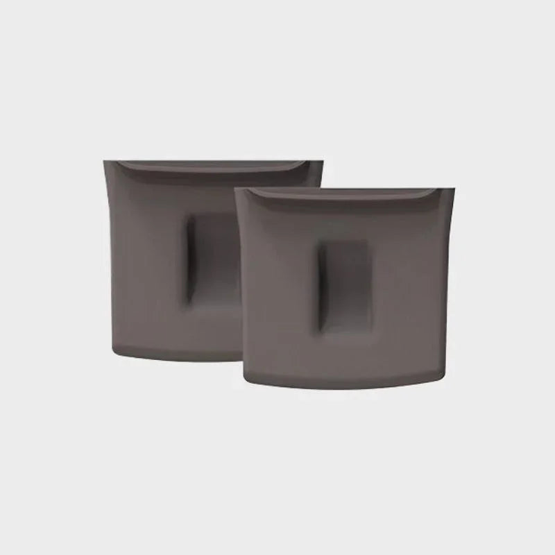 Two grey matte-finish car interior accessories with recessed grip detailing.