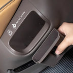 Brown silicone storage tray fitting into a car seat back pocket