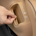 Tan leather car door pocket featuring a 50W wireless Qi charging compartment.