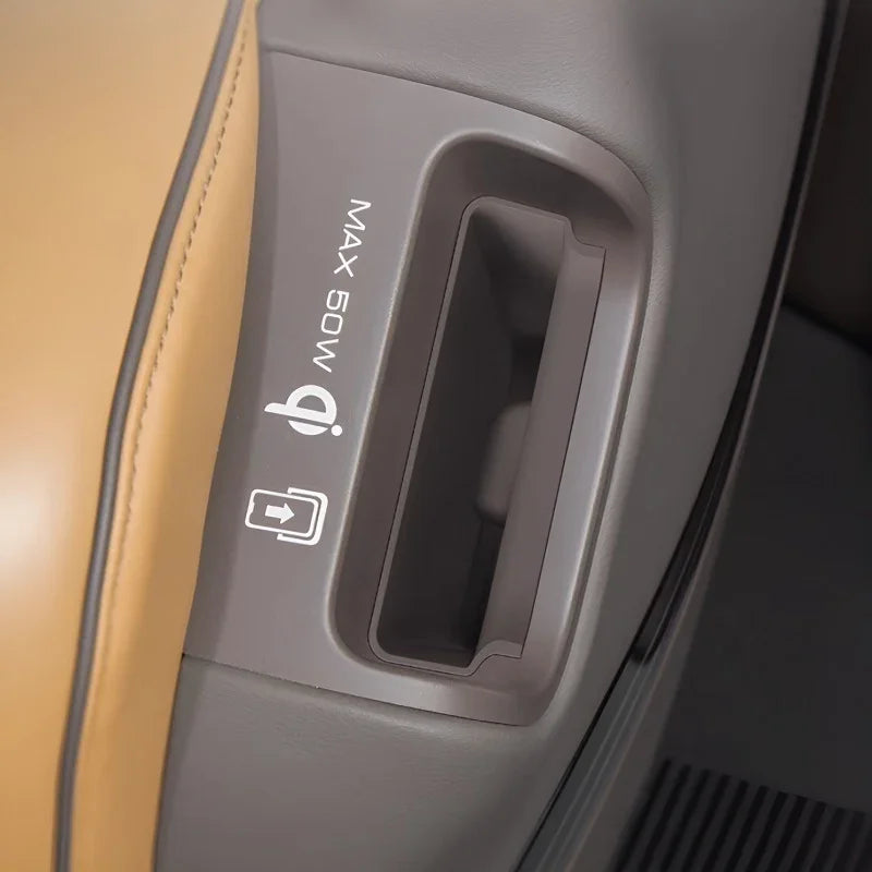 Grey plastic interior panel with a 50W USB charging port and tan leather stitching.