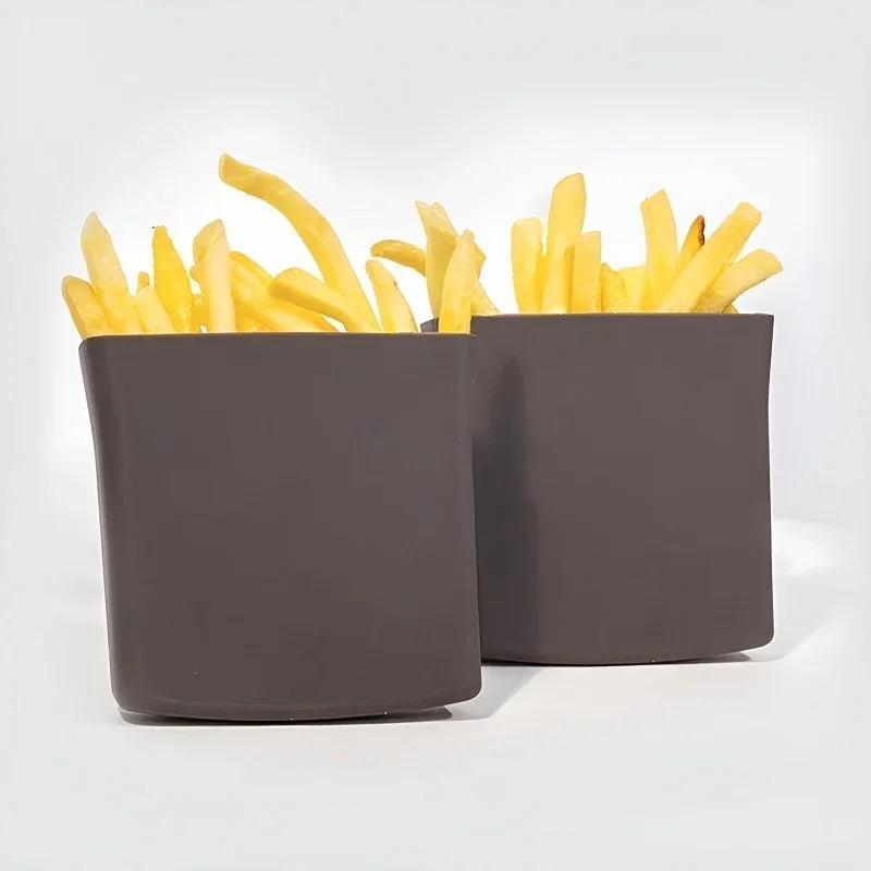 Two dark grey matte finish containers filled with golden french fries.