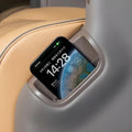 Grey premium leather smartphone holder installed in a tan car interior seat.