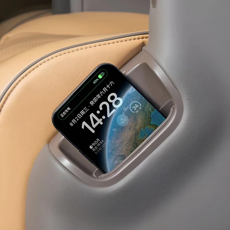 Grey premium leather smartphone holder installed in a tan car interior seat.