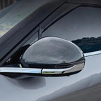 Carbon fiber texture side mirror cover in grey and black for a sleek, sporty car upgrade.