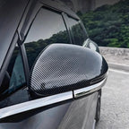 Professional carbon fiber side mirror cover in grey for BYD car with sleek chrome trim.