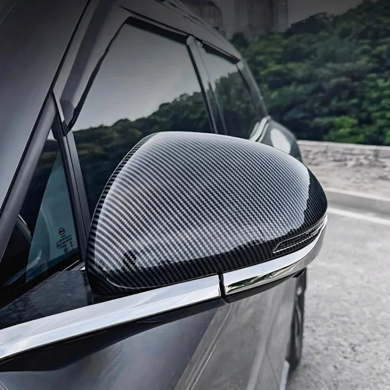 Professional carbon fiber side mirror cover in grey for BYD car with sleek chrome trim.